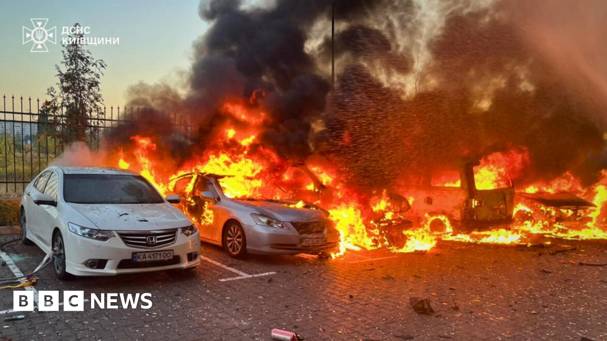 Vehicles are burning in Ukraine's Kyiv region following an overnight Russian aerial attack