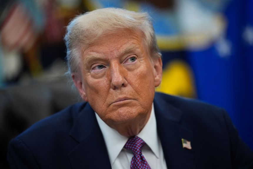 President Donald Trump looks on while signing executive orders in the Oval Office of the White House on September 5.