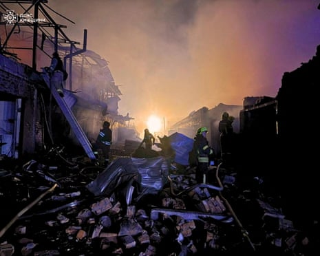 Firefighters work at the site of car garages hit by a Russian drone strike, amid Russia’s attack on Ukraine, in the city of Bila Tserkva, Kyiv region, Ukraine.