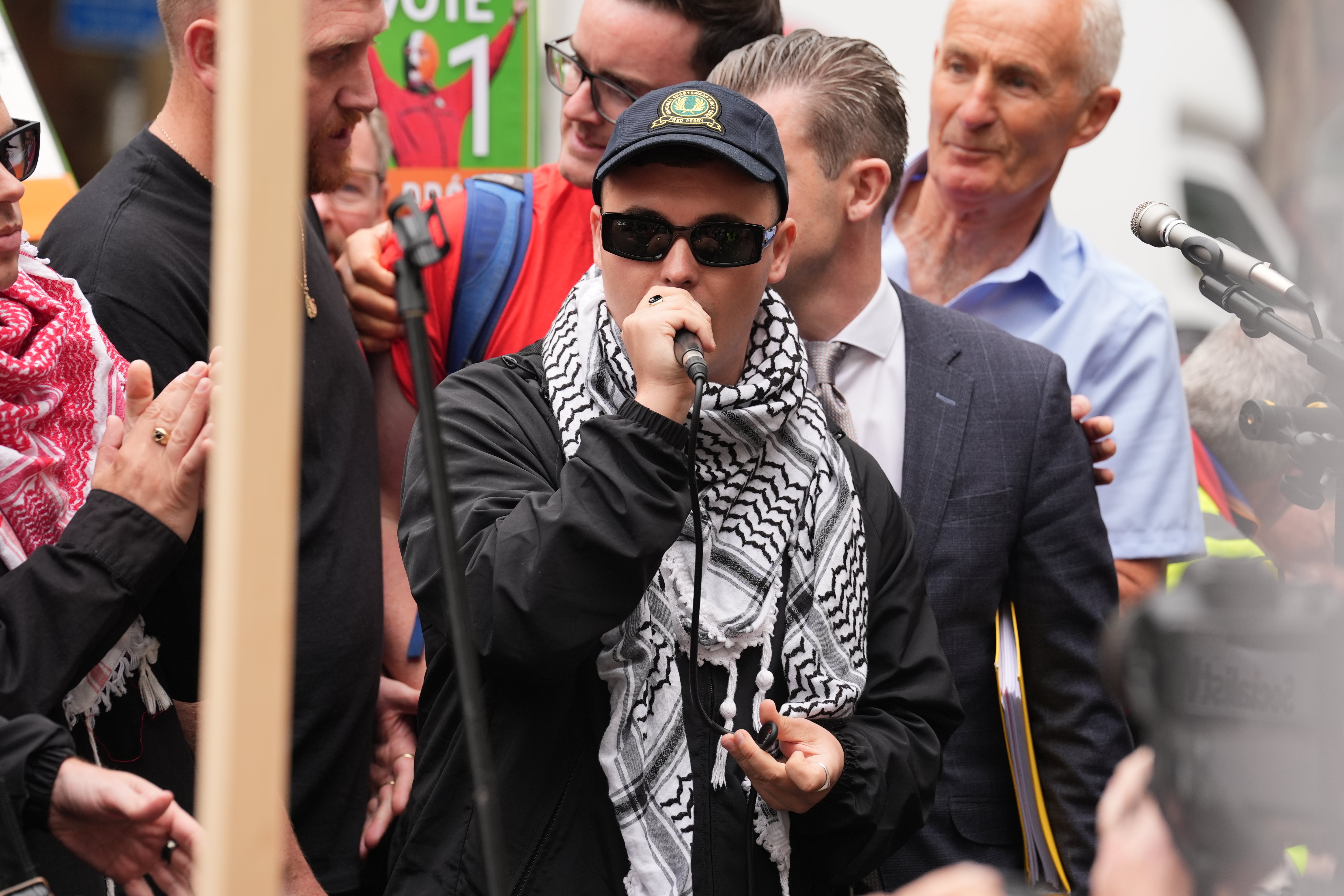 Kneecap’s Liam Og O hAnnaidh speaks to supporters as he leaves Westminster Magistrates’ Court in London