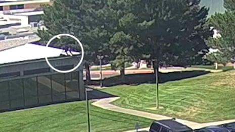 Utah officials show new video of suspect fleeing roof in Charlie Kirk shooting – video