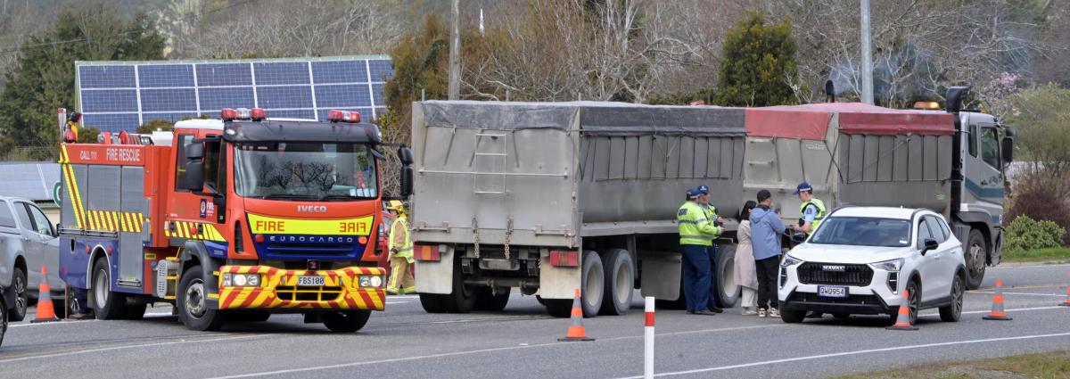 Three escape with minor injuries as truck, car crash in Waitati