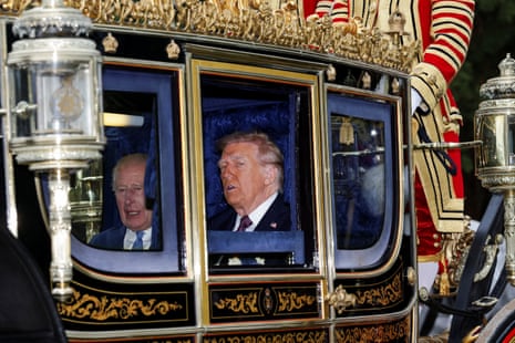 King Charles and Donald Trump sit in a carriage during a procession through Windsor Castle.