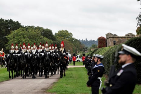 Members of the Royal Navy Ceremonial Guard line up the route ahead of the carriage procession.