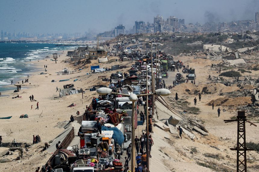 Thousands of Palestinians are seen trying to leave Gaza City on Tuesday, as Israel announced it had begun a ground offensive into Gaza's largest city.