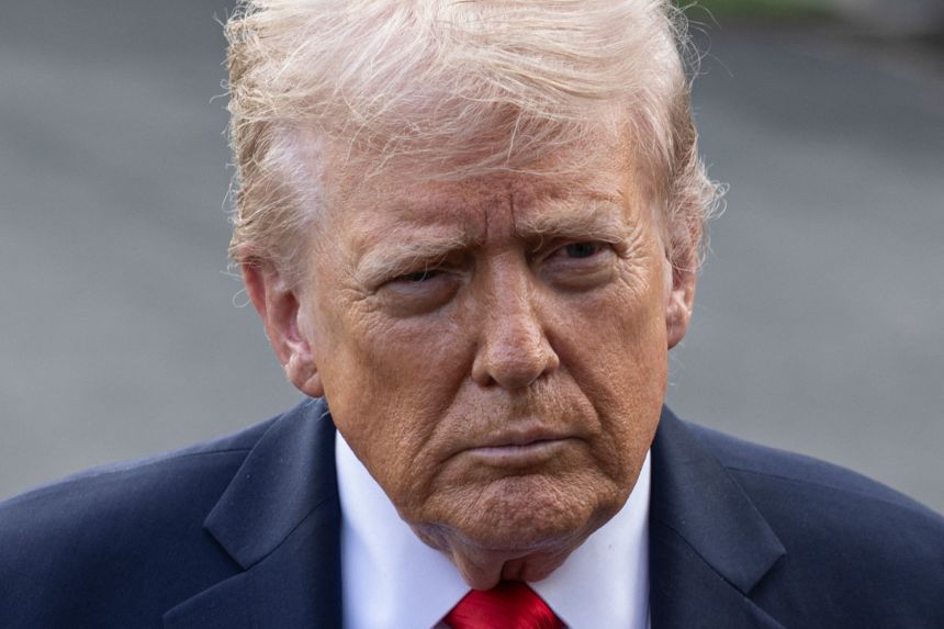 President Donald Trump speaks to the media before boarding Marine One on the South Lawn of the White House on September 11.