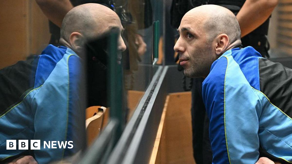 Cédric Jubillar behind a glass pane in court on Monday