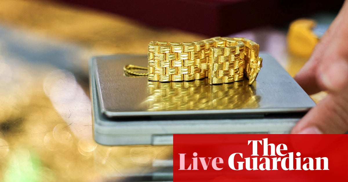 Gold hits record high in best year since 1979; JLR production shutdown extended by another week – business live | Business