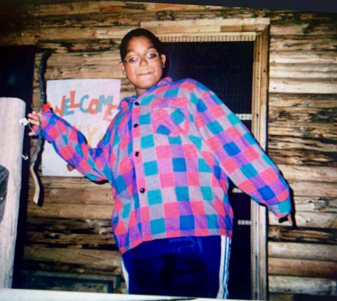 Samuel Provo-Benoit, around 10-years-old, wearing a pink and blue checkered shirt.