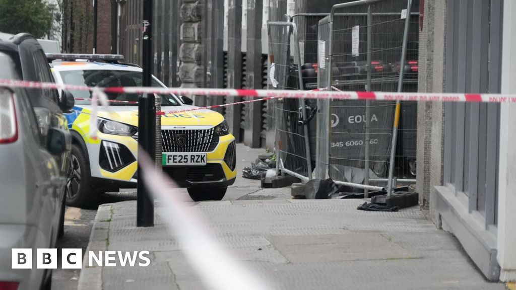 Man arrested after fire at London asylum seekers' hotel