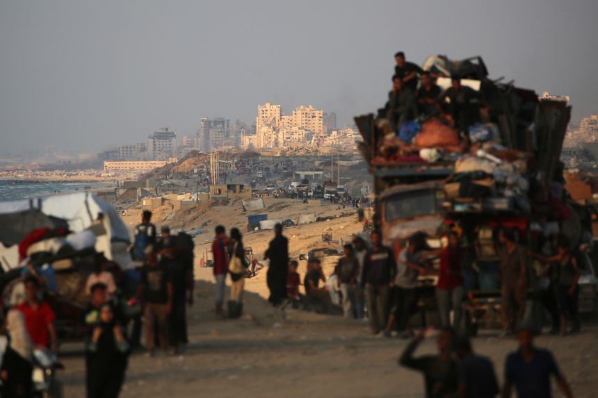 Displaced Palestinians move southwards on Wednesday, as Israeli forces extend their control over Gaza City. More than 700,000 Palestinians have left the area, according to the Israeli military.