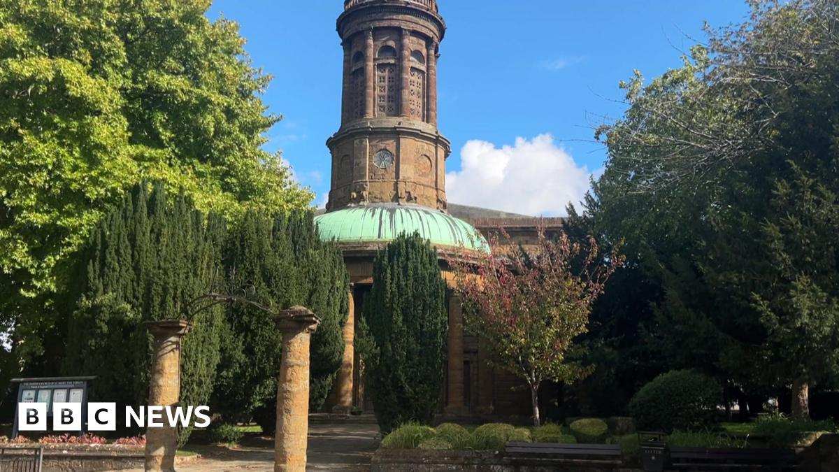 St Mary's Church is a large brown building with green space in front, and around it.