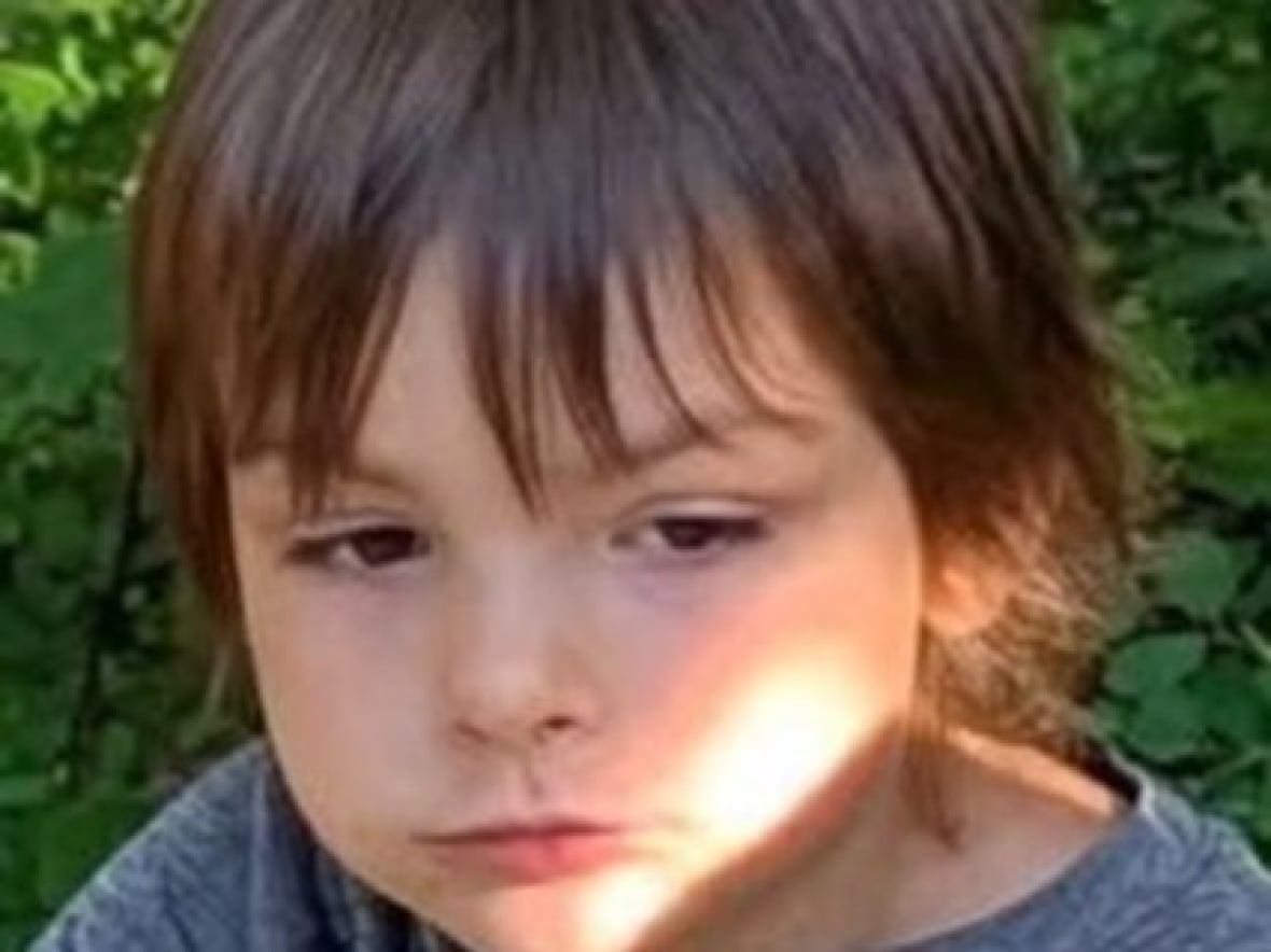 a close up shot of a young boy 