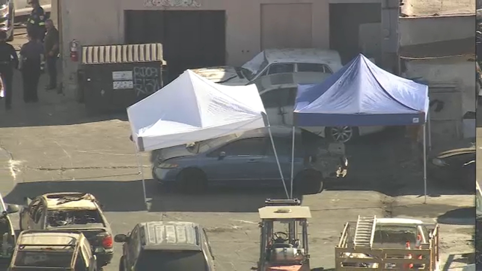Police investigating body found in car at Al's Towing in South Los Angeles