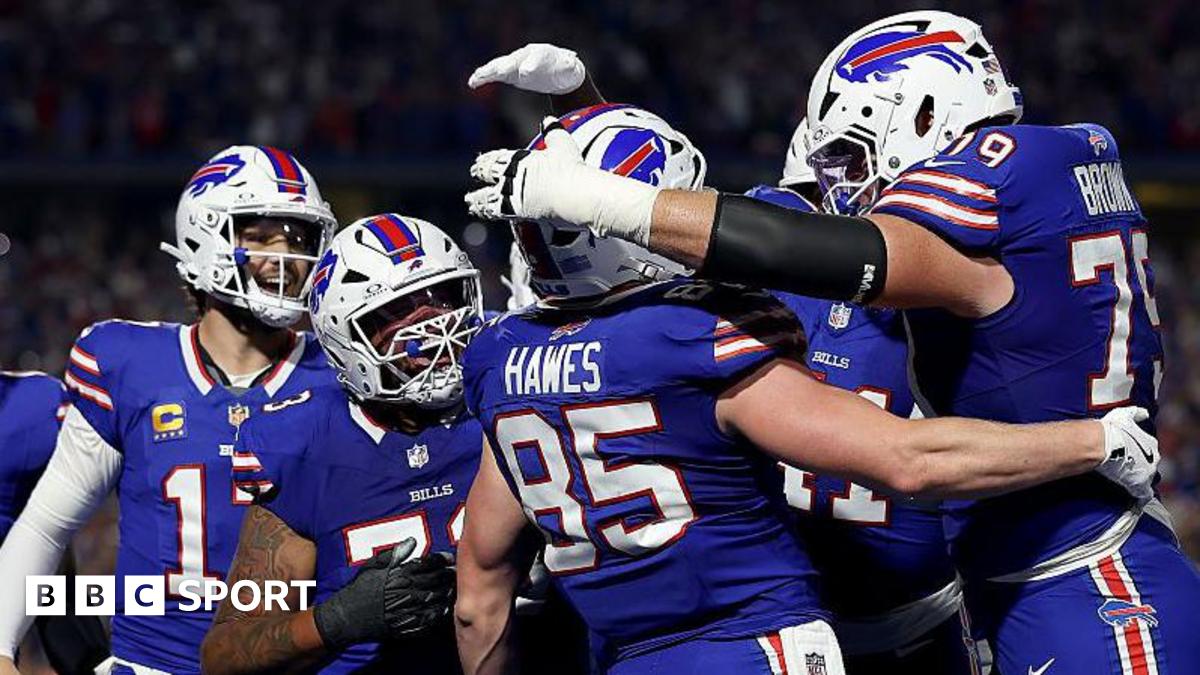 Buffalo Bills players congratulate Jackson Hawes after he scores a touchdown against the Miami Dolphins