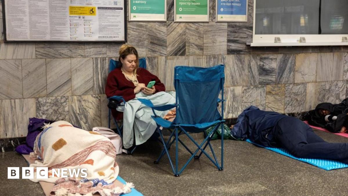 People take shelter in a metro station during a Russian drone attack on Ukraine, in Kyiv