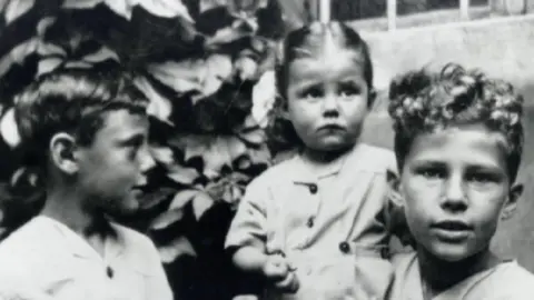 Family photo Giorgio Armani (left) with childhood friends during World War II in Italy