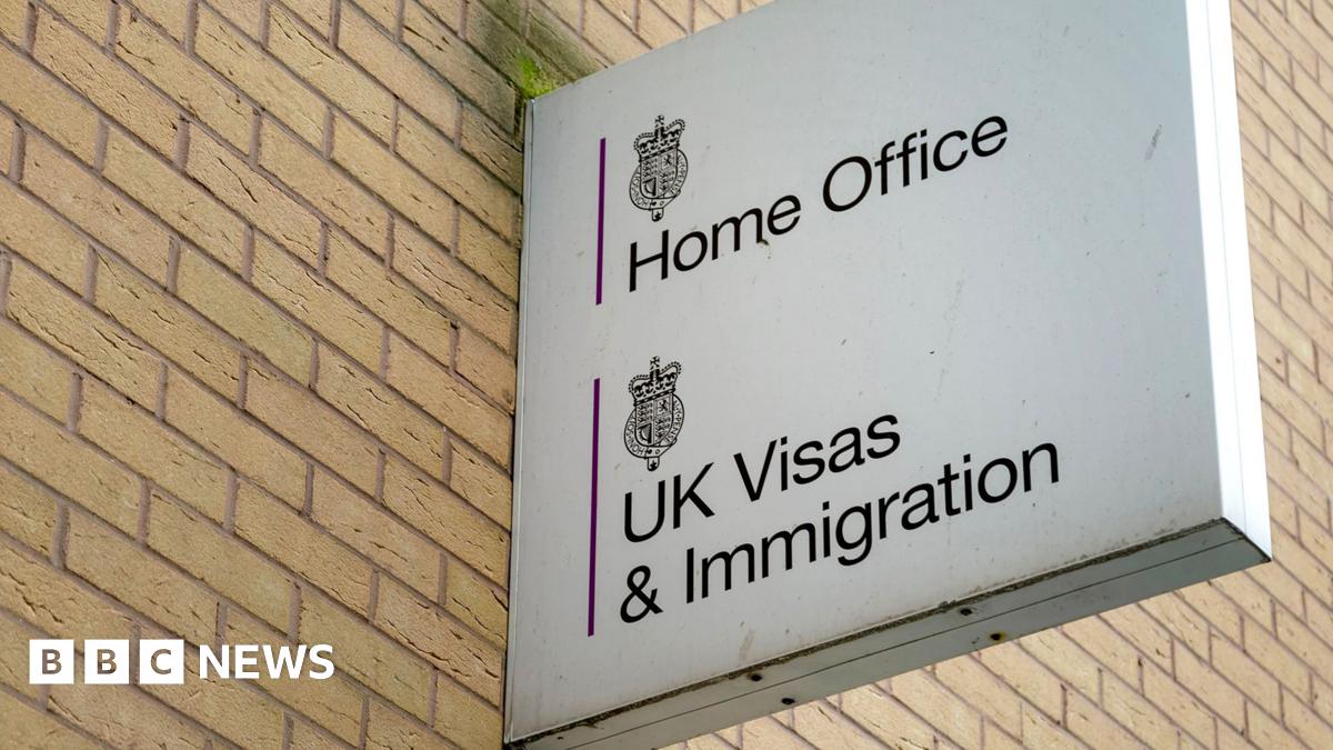 A sign reading "Home Office, UK Visas and Immigration"