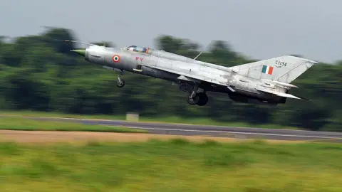 AFP via Getty Images An Indian Air Force (IAF) MIG-21 takes off during a drill for Air Force Day celebrations in Kalikunda IAF airbase around 170 km west of Kolkata on September 29, 2011