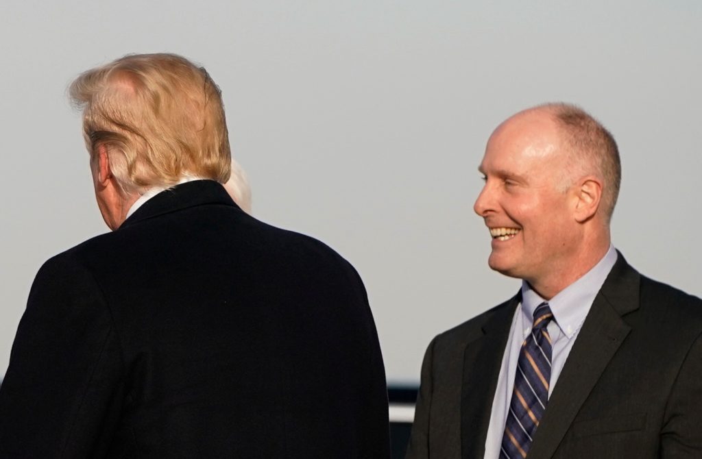 President Donald Trump is greeted by U.S. Representatives from Michigan and state officials upon arrival in Grand Rapids M...