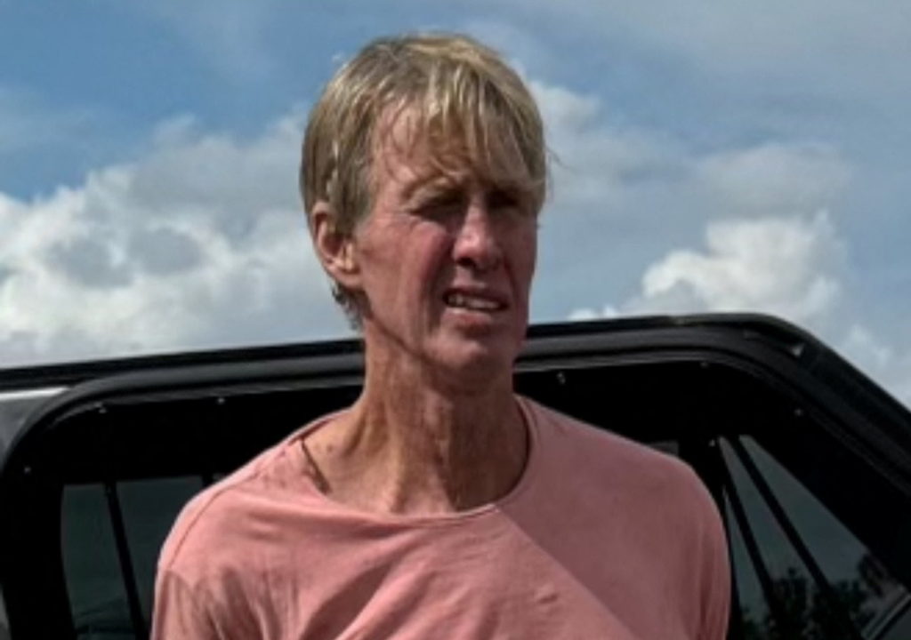 Suspected Trump golf course gunman Ryan W. Routh stands handcuffed after his arrest during a traffic stop near Palm City