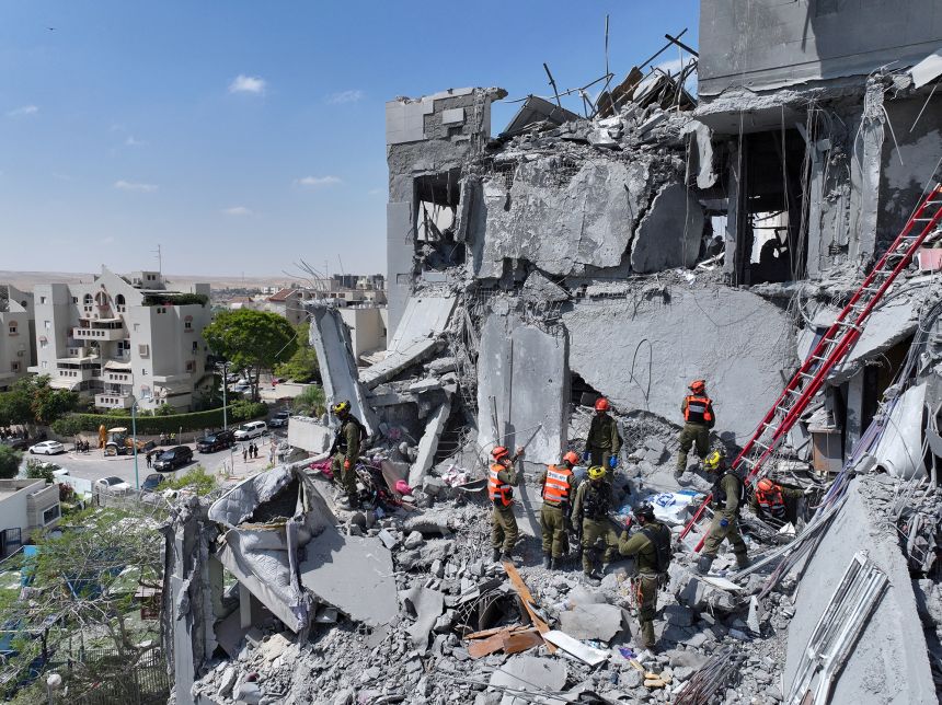 Emergency personnel work at a sire of an Iranian missile attack in Be'er Sheva, Israel, on June 24, 2025.