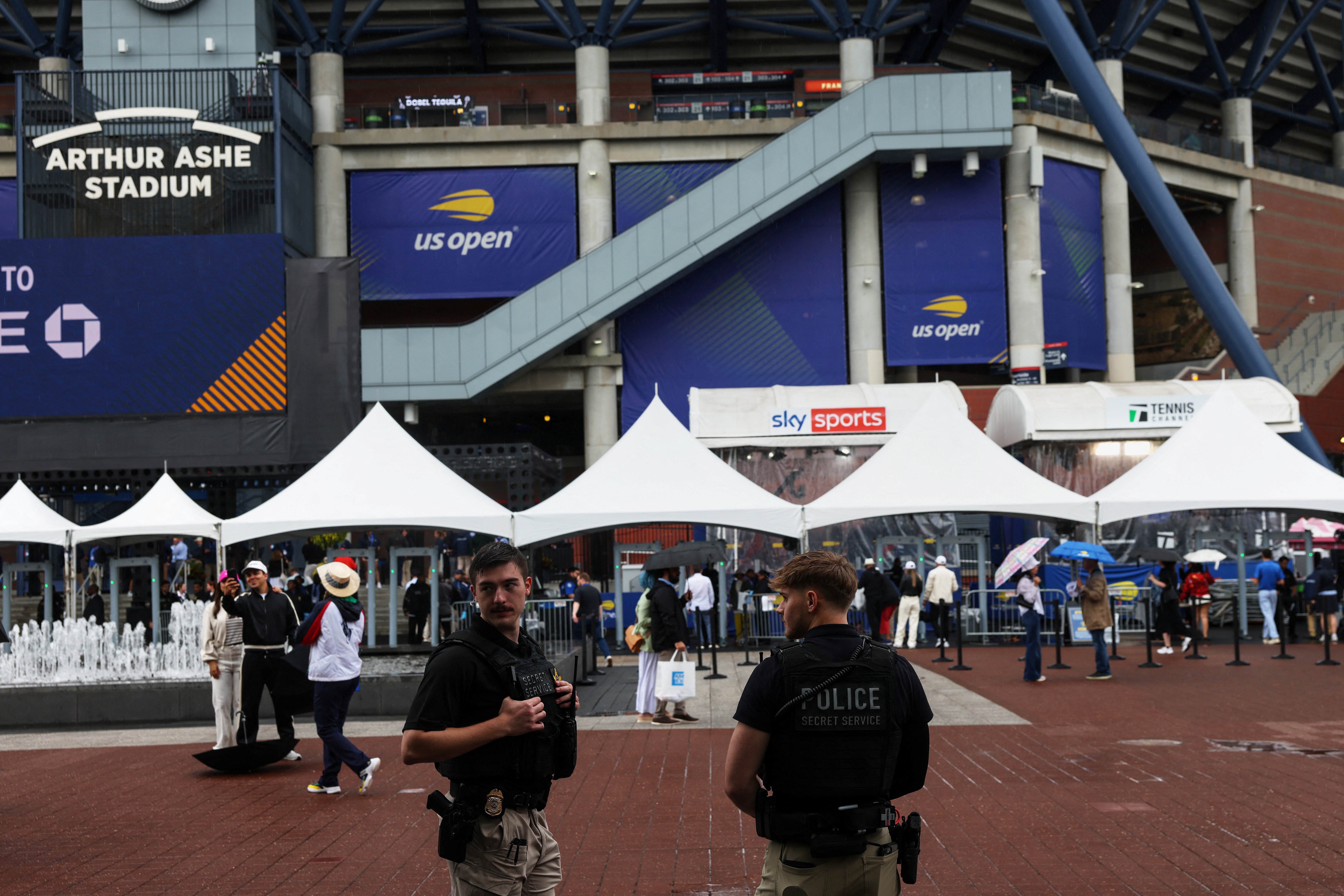U.S. Secret Service agents stand guard, before U.S. President Donald Trump attends the final match of the U.S. Open, outside Arthur Ashe Stadium in the Queens borough of New York City