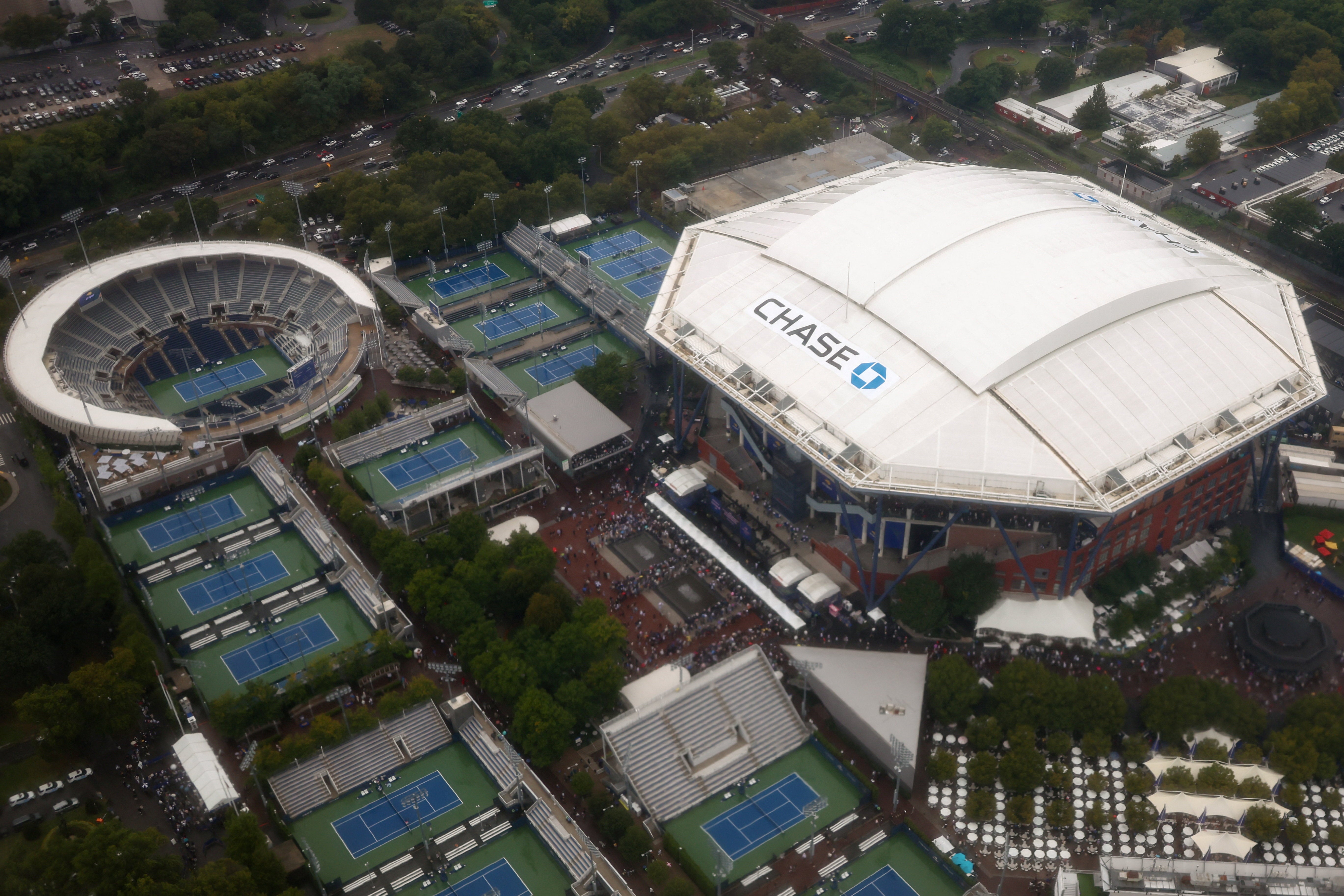 ‘Doing a Flyover of the Tennis Center right now. We’ll be landing shortly. Should be a great Match!’ Trump posted on Truth Social from Air Force One, shortly before his arrival