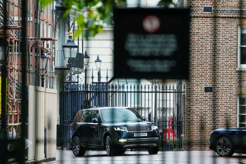 Prince Harry, inside a vehicle, arrives at Clarence House on Wednesday afternoon.