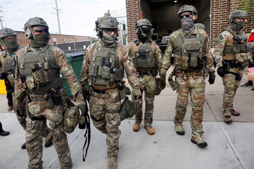 Immigration and Customs Enforcement officers stand guard during a protest outside an ICE facility in Broadview, Illinois, on September 12.