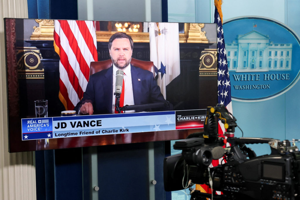 U.S. Vice President Vance appears on video monitors as a guest presenter for Kirk’s podcast, at the White House in Washington