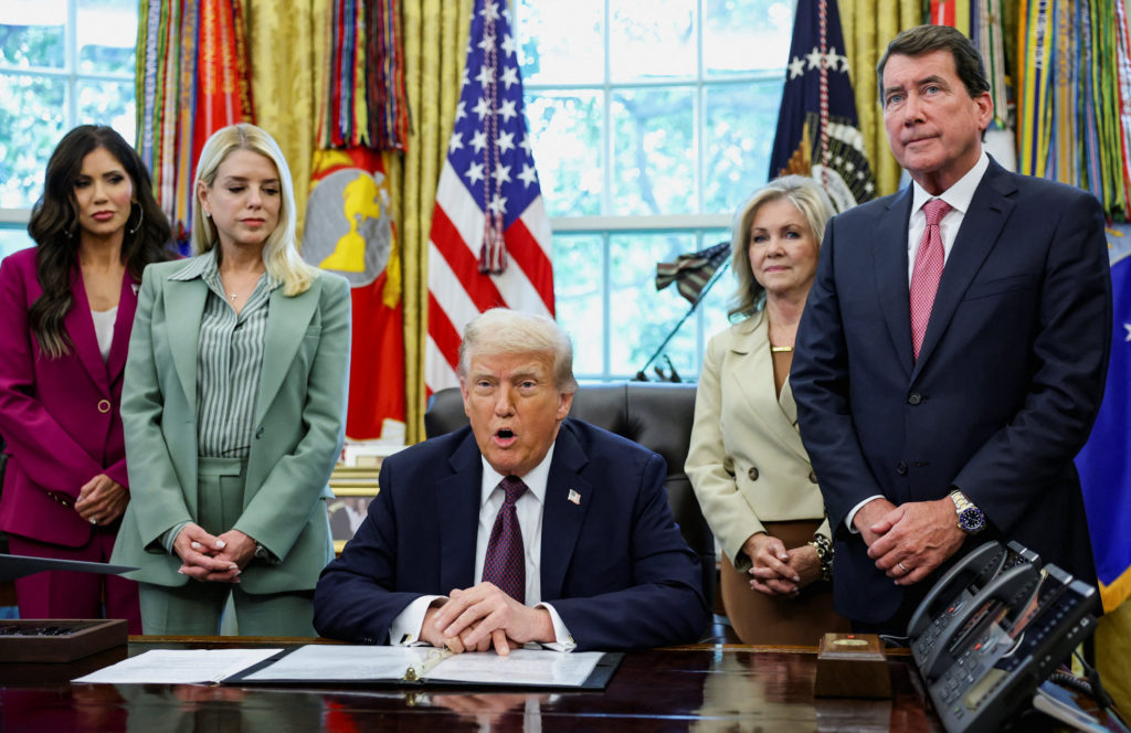 U.S. President Trump signs a memorandum at the White House in Washington