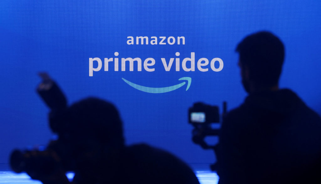 FILE PHOTO: Media are seen in front of an Amazon Prime Video logo in Mumbai