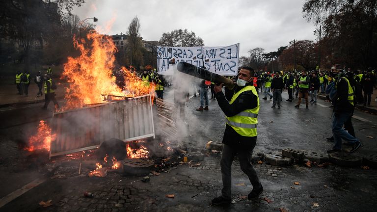 Gilets jaunes build a barricade in Paris during protests against high living costs in 2018. File pic: Imagebridge