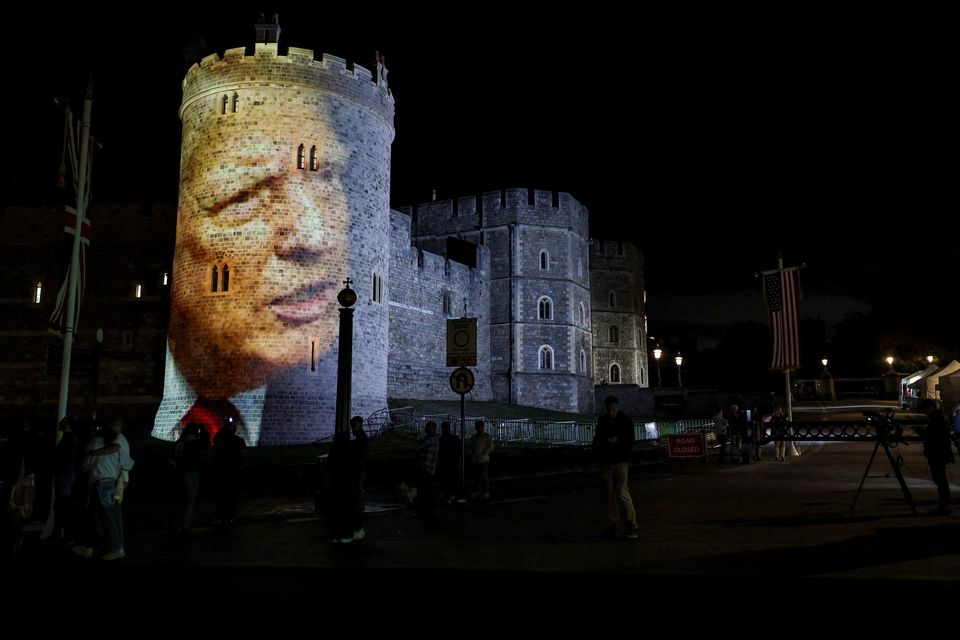 An image of U.S. President Donald Trump is projected on Windsor castle, after U.S. President Donald Trump and first lady Melania Trump arrival for a state visit to the country, in Windsor, Berkshire, Britain September 16, 2025. REUTERS/Phil Noble