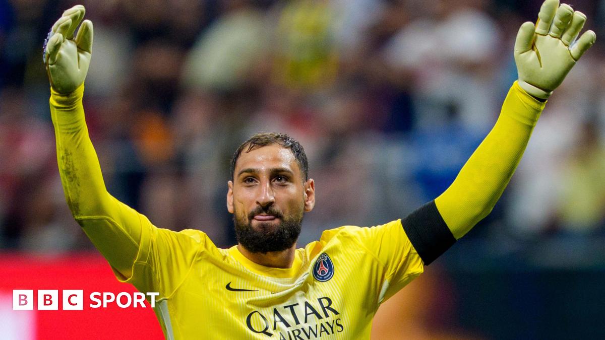 Gianluigi Donnarumma raises his arms in celebration while playing for Paris St-Germain