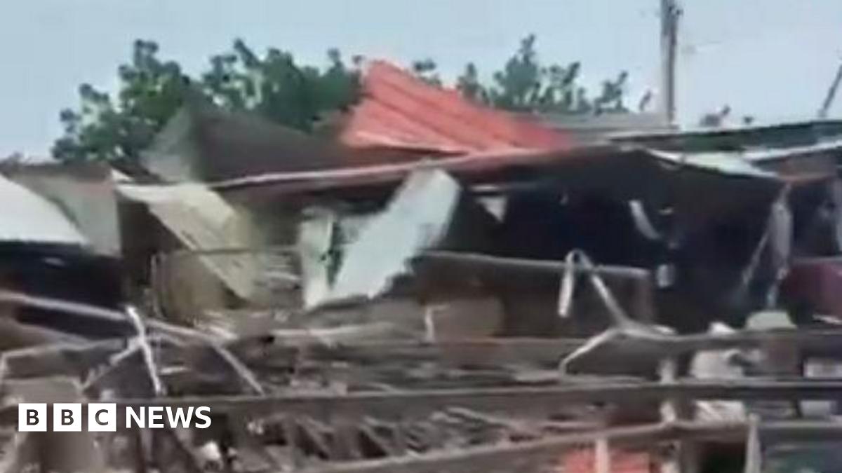 A screengrab from a video posted on X, showing the mangled remains of a mosque. It is quite blurry.