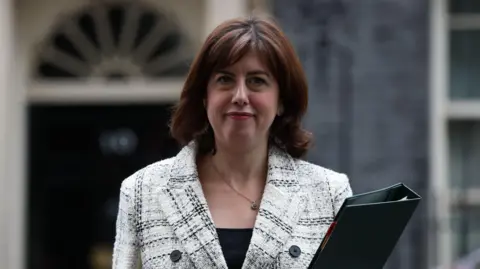 EPA Lucy Powell outside 10 Downing Street holding a black folder.