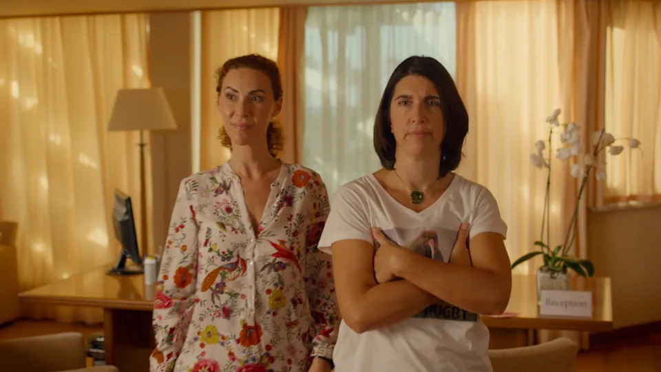 Pictured (L to R): Dora Chrysikou as Helen Moustakas and Emily Corcoran as Shirley Rangi in 'The Sunshine Murders'