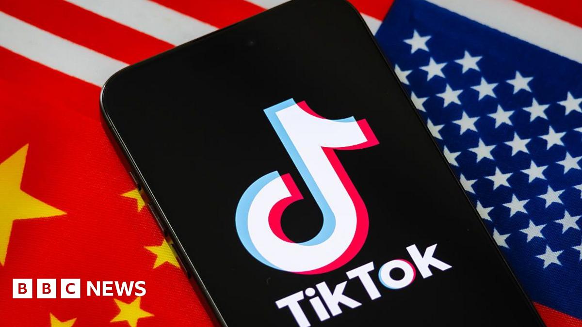 In this photo illustration, a smartphone displays the logo of TikTok, the short-video social media platform owned by China's ByteDance, with the national flags of China and the United States shown in the background.