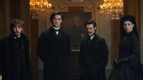 Netflix Fionn O'Shea, Louis Partridge, Anthony Boyle, Emily Fairn as their characters in House of Guinness wearing Victorian dress 