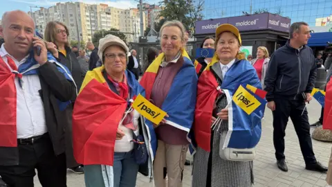 Protesters with signs in Chisinau