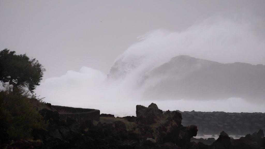 A photo of huge waves hitting the coast of the Azores