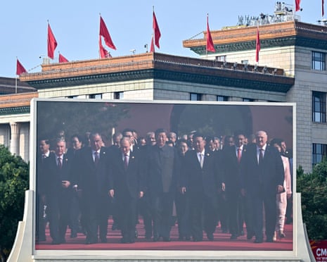 Xi Jinping (C) walks alongside Russia’s president Vladimir Putin (centre L) and North Korea’s leader Kim Jong -un (centre R)