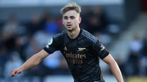 Getty Images Billy Vigar, a young man with short blond hair, playing for Arsenal