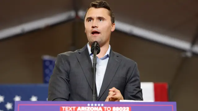 Charlie Kirk speaking at a political rally