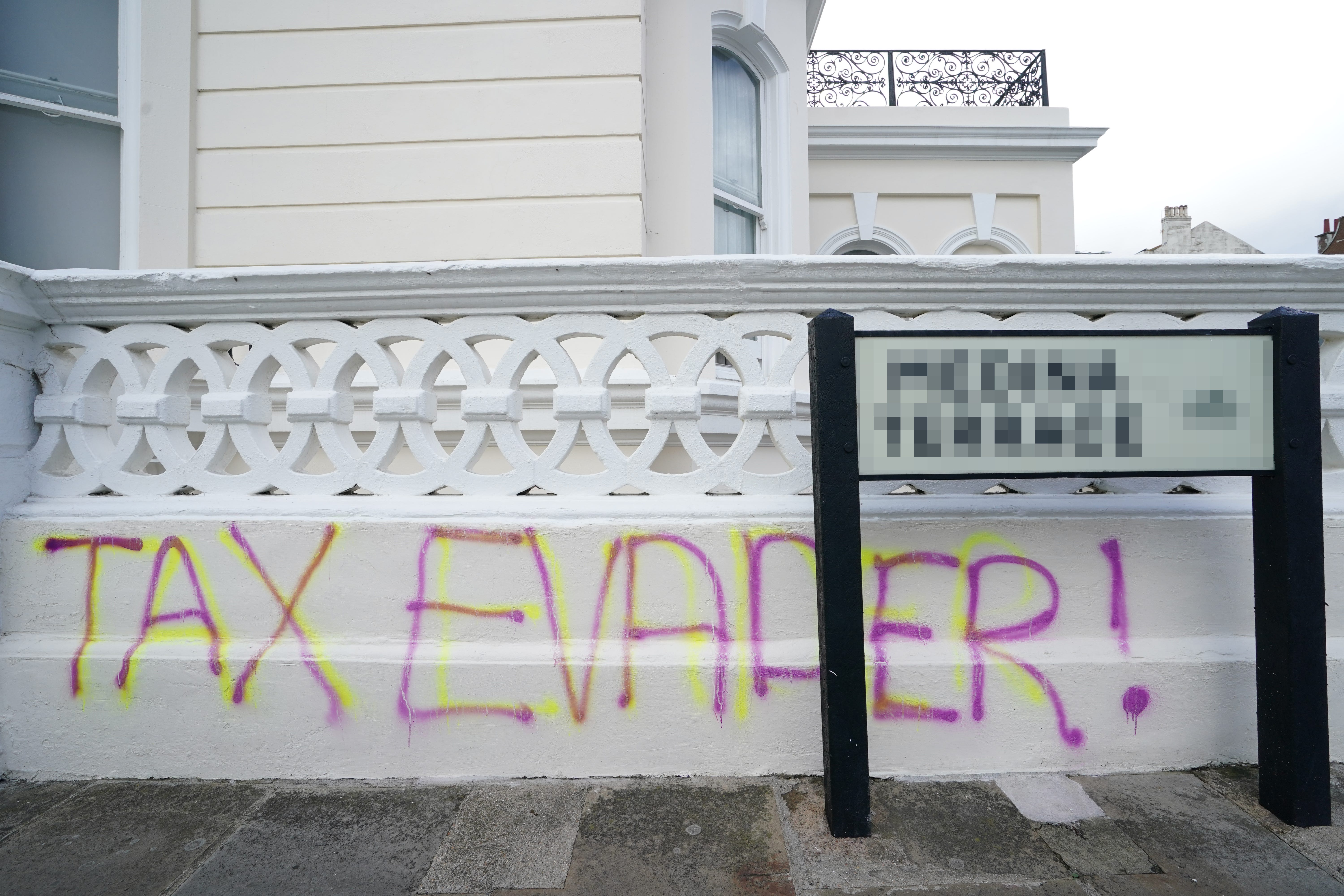 Graffiti outside the apartment building in Hove, East Sussex (Gareth Fuller/PA)