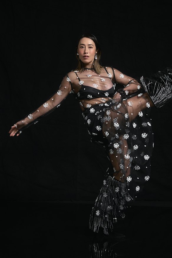 Macgraw “Dorothea” top and skirt. Ryan Storer earrings. Michael Kors boots.