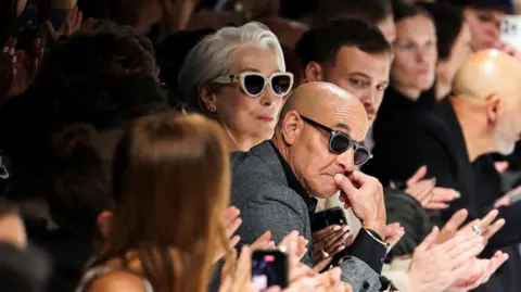 Reuters Meryl Streep and Stanley Tucci look on at the end of the Dolce & Gabbana spring/summer 2026 collection show during Fashion Week in Milan, Italy, September 27, 2025.