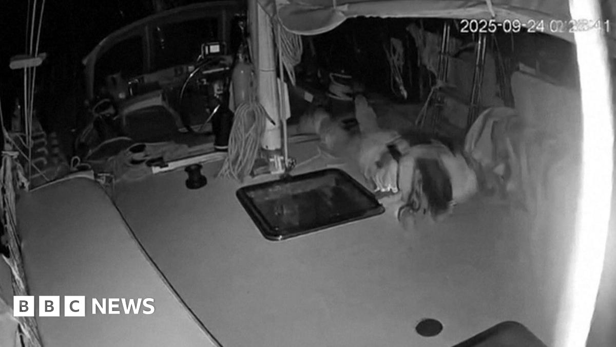 Screengrab of video footage released by the Global Sumud Flotilla (GSF) purportedly showing a man diving for cover after a drone attack on a Gaza-bound vessel off the coast of Crete (24 September 2025)